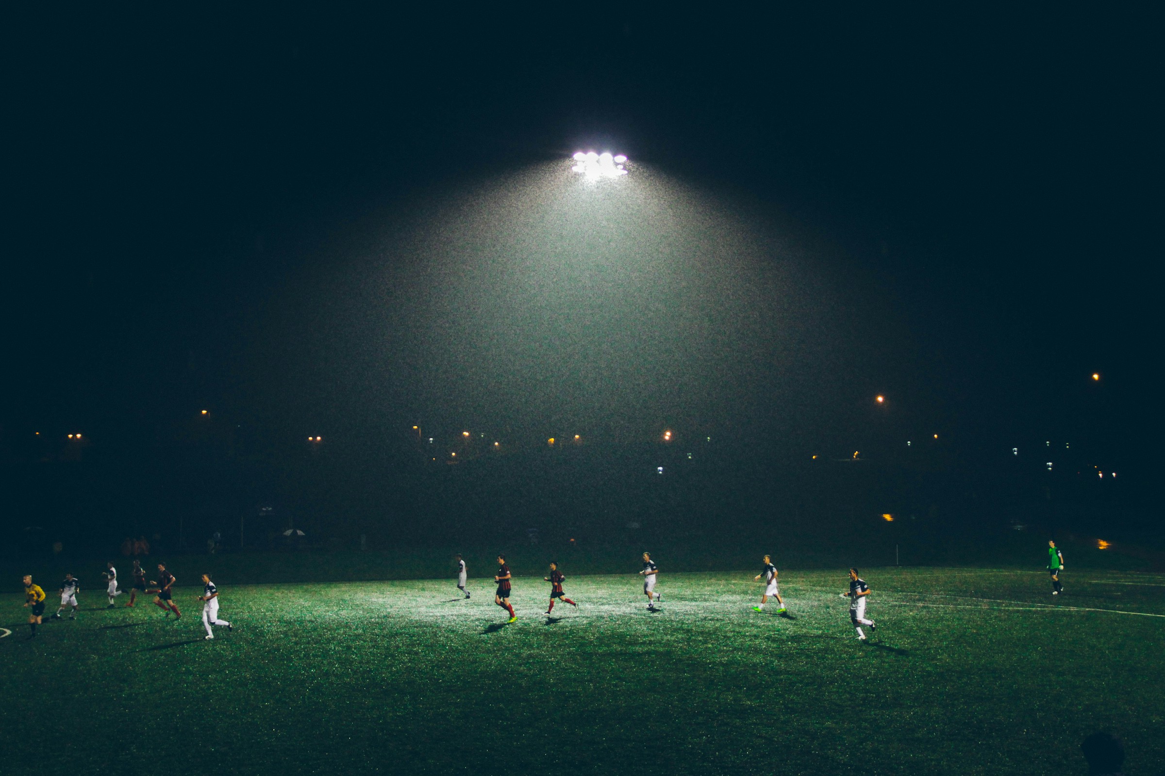 Football match under floodlights
